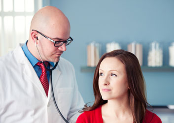 Doctor administering direct primary care to a patient